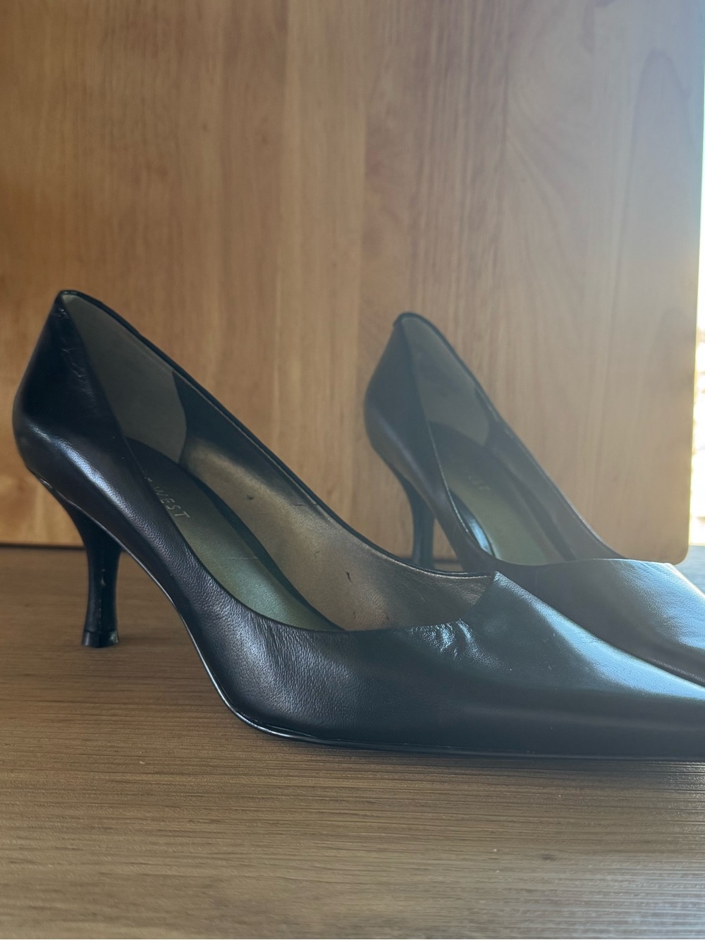Nine West black patent pumps